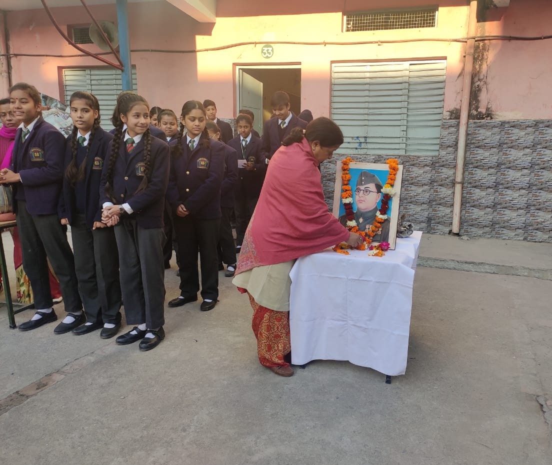 Garlanding the portrait of Netaji Subhash Chandra Bose